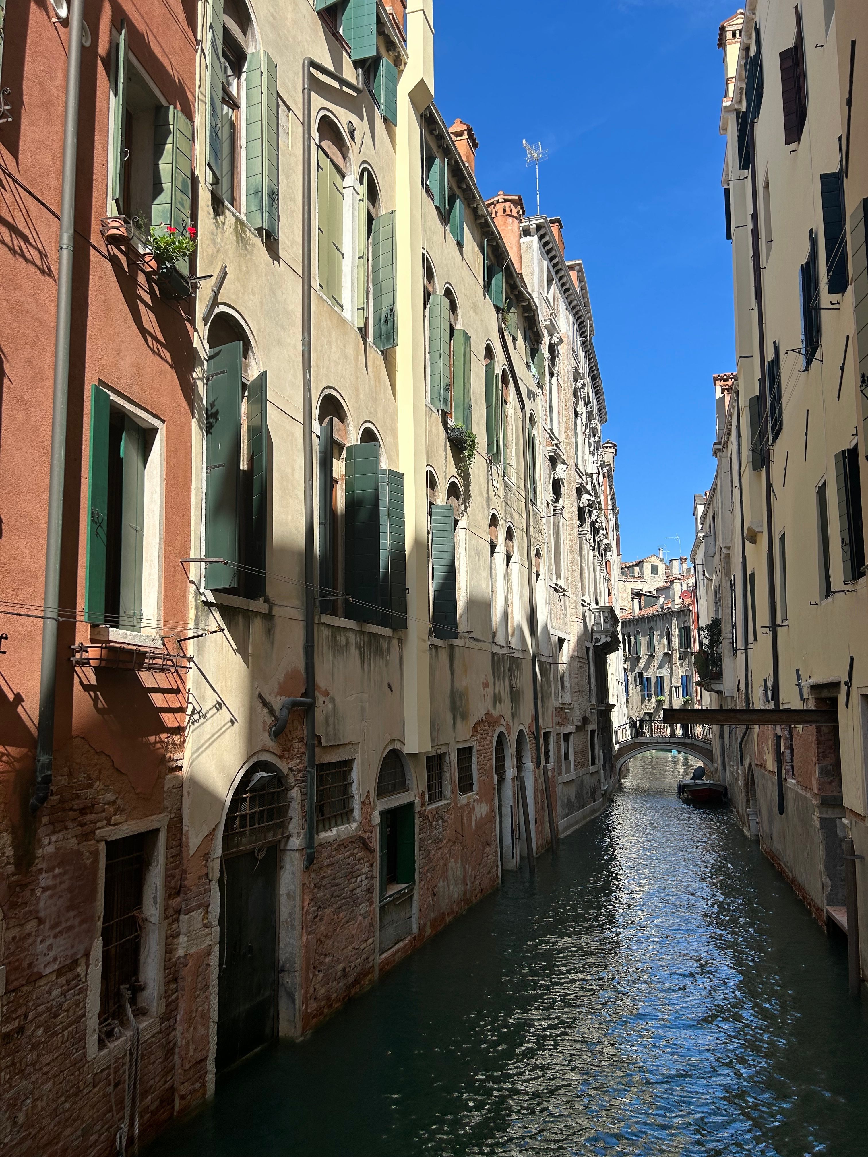 Historic Venice canal lined with Renaissance buildings, home to the famed Venetian courtesans